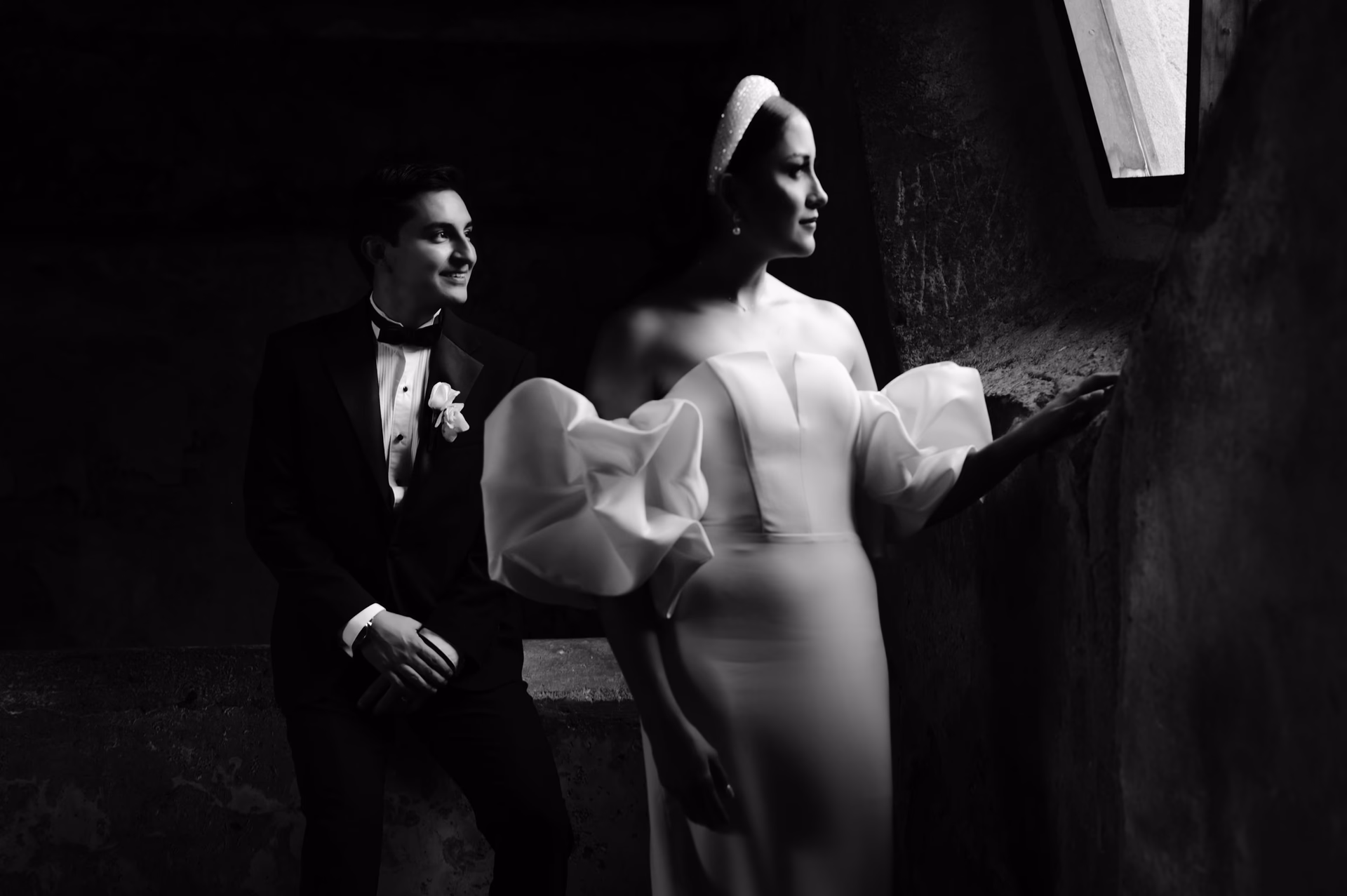 Black and white wedding couple in dramatic light